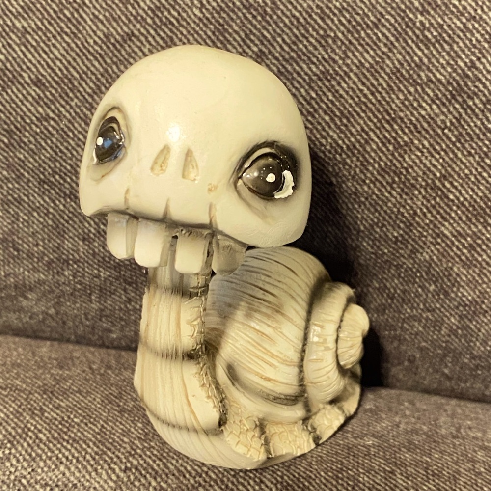 Cute bobble head skeleton snail